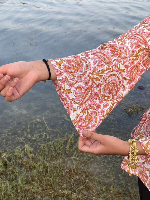 Women's peach printed kurti with bell sleeves