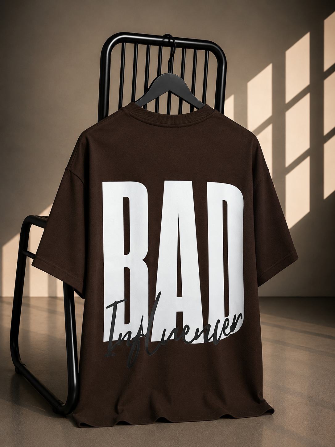 Brown oversized Bad Influencer graphic T-shirt with bold back typography print by Jayzzedup