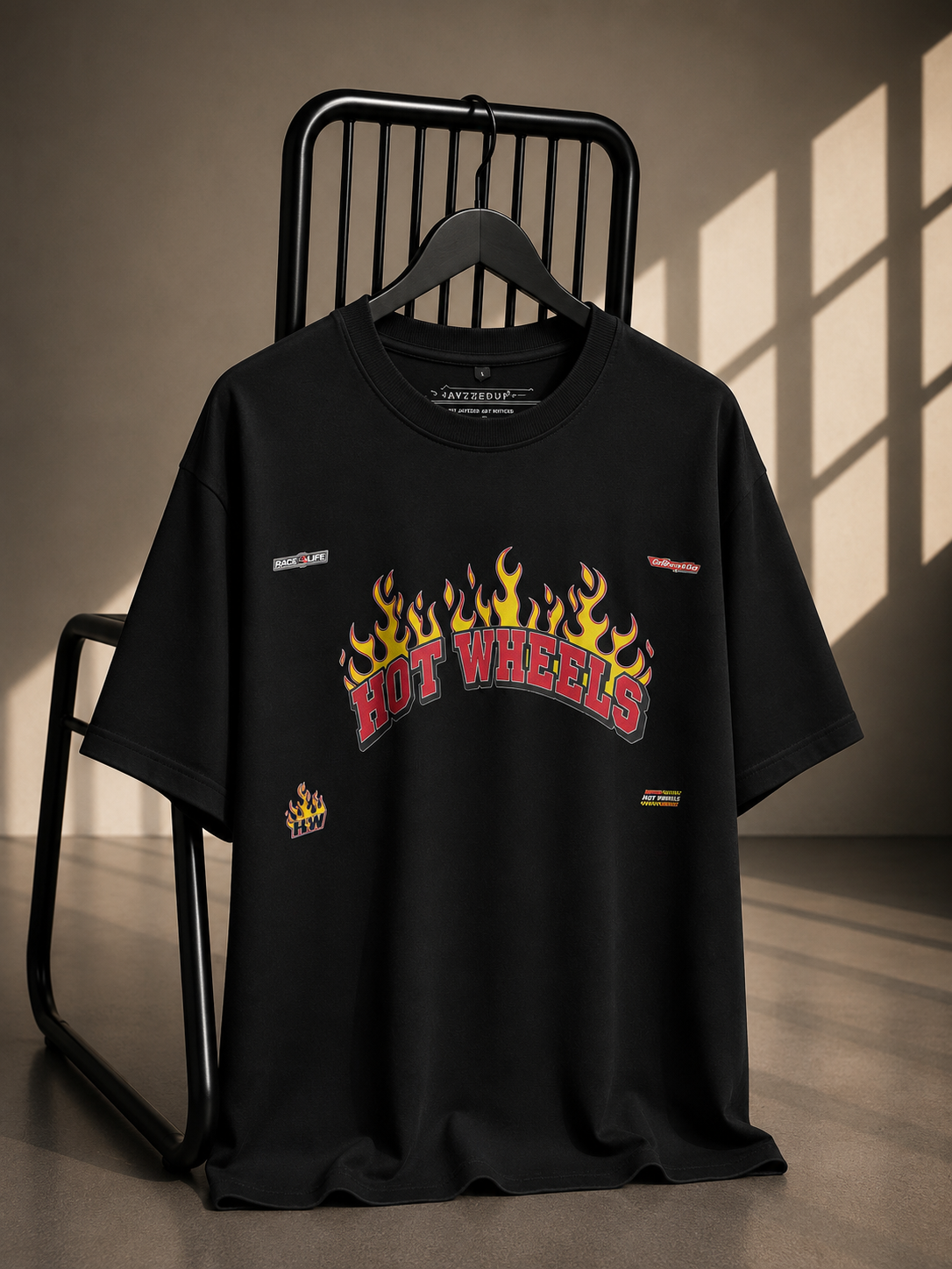 Black oversized French Terry cotton T-shirt featuring a Hot Wheels flame graphic on the front.