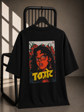 Black oversized unisex T-shirt featuring a bold vintage-inspired Toxic graphic artwork on premium 180 GSM bio-washed cotton.