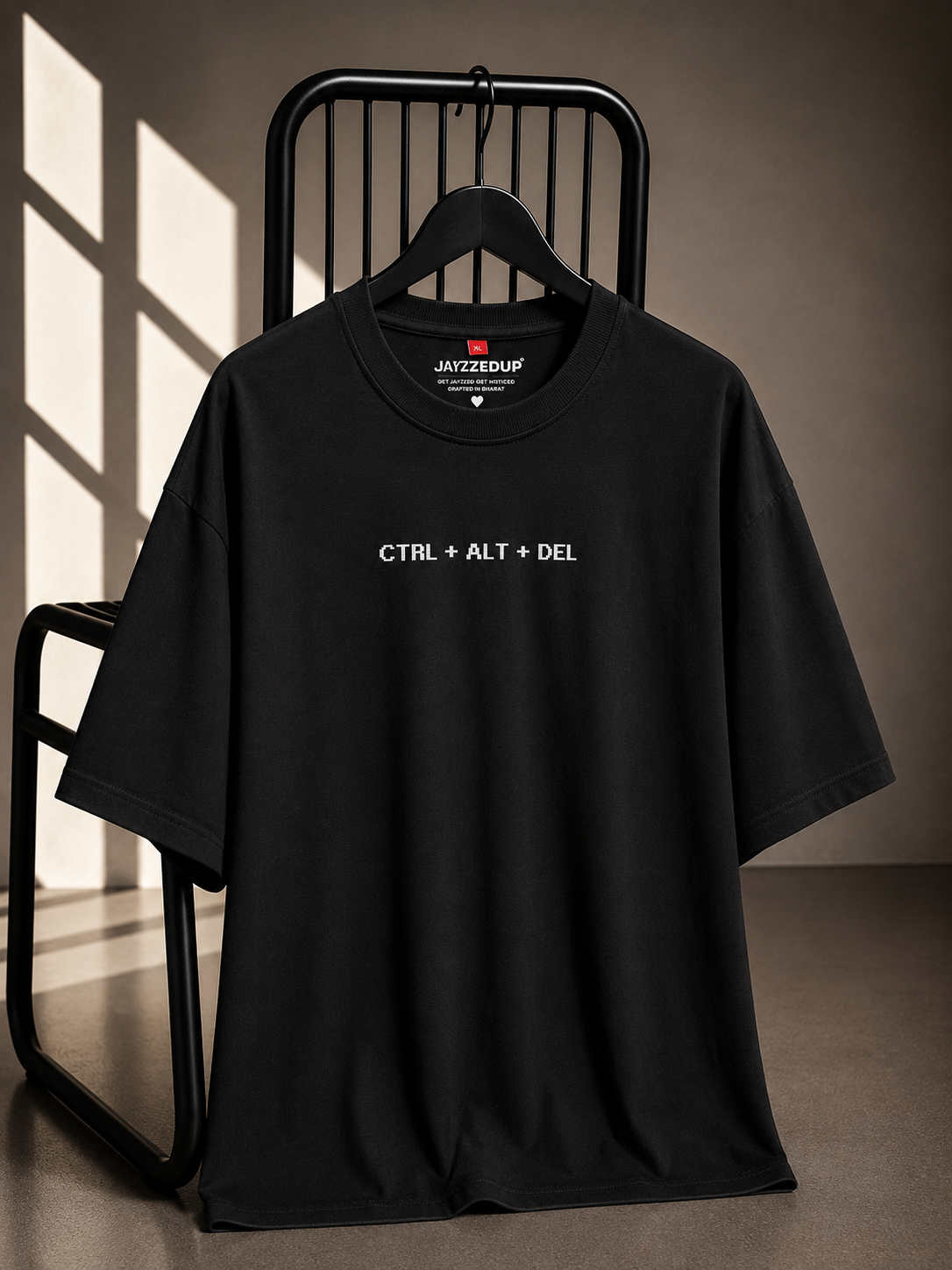 Black oversized unisex graphic T-shirt featuring a minimalist CTRL + ALT + DEL chest print, made from 220–240 GSM bio-washed French Terry cotton.