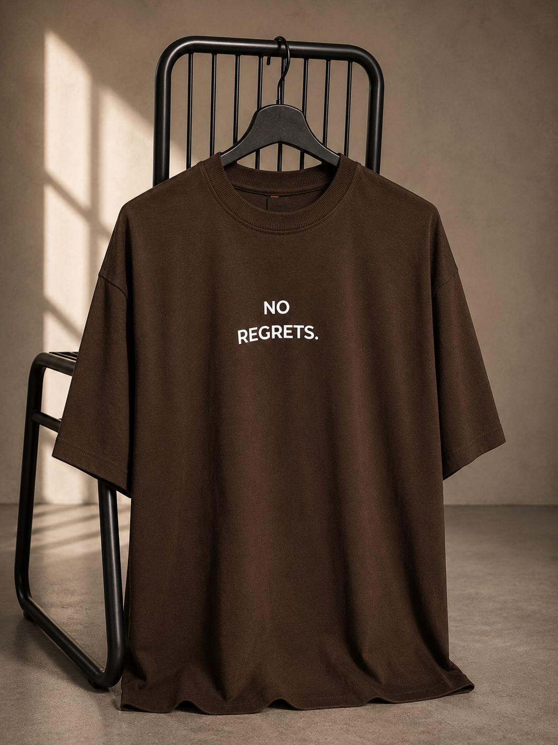 Brown oversized French Terry cotton T-shirt with No Regrets front print.