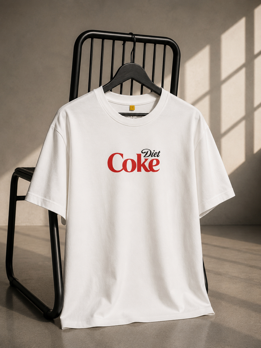 White oversized unisex graphic T-shirt featuring a minimal Diet Coke inspired chest print, made from 220–240 GSM bio-washed French Terry cotton.
