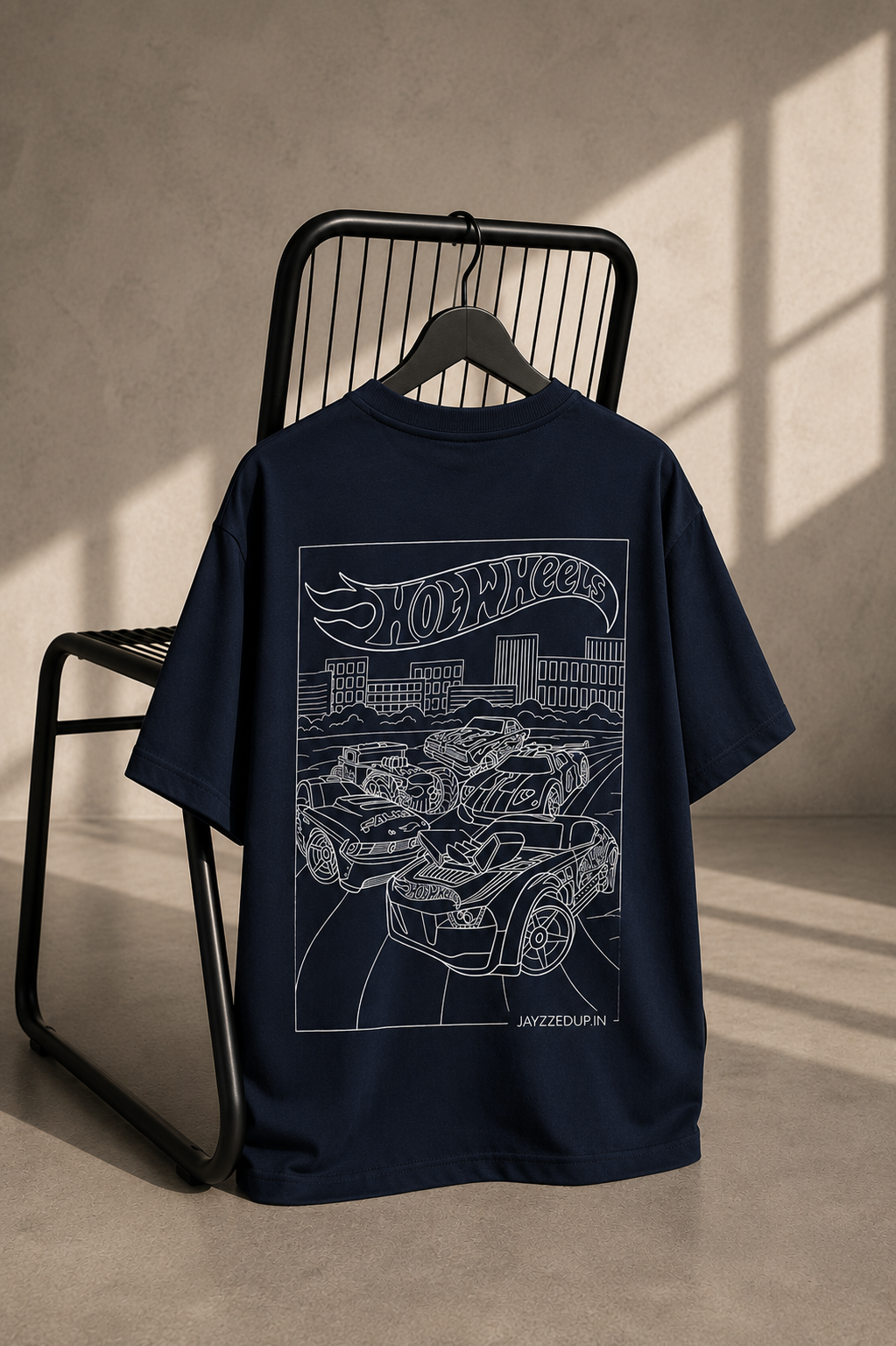 Navy oversized unisex T-shirt featuring a detailed Hot Wheels line art illustration of performance cars on heavyweight French Terry cotton.