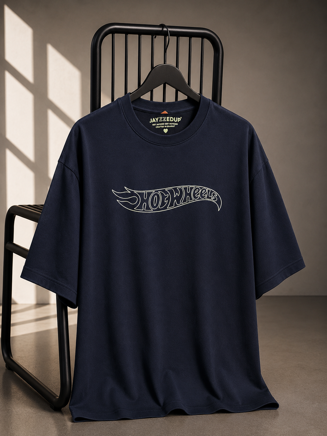 Navy oversized unisex graphic T-shirt featuring a minimalist Hot Wheels chest logo, made from 220–240 GSM bio-washed French Terry cotton.