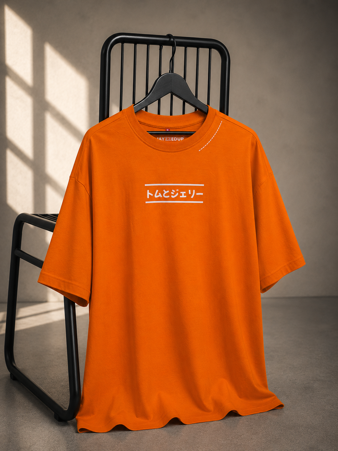 Orange oversized French Terry cotton T-shirt with minimalist Frenemies Forever front graphic.