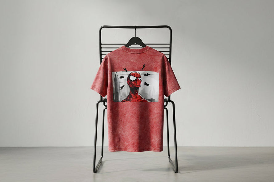 Red acid wash oversized T-shirt with bold graphic artwork on the back and premium vintage finish.