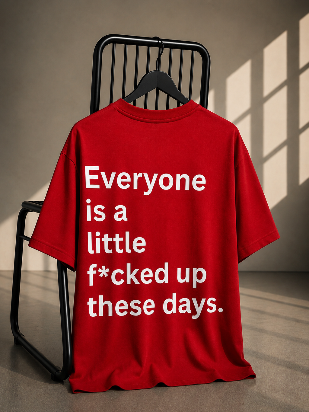 Red oversized French Terry cotton T-shirt featuring a bold statement typography graphic on the back.