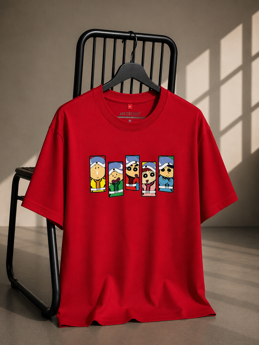 Red oversized French Terry cotton T-shirt featuring a colorful Shin Chan inspired friends graphic on the front.
