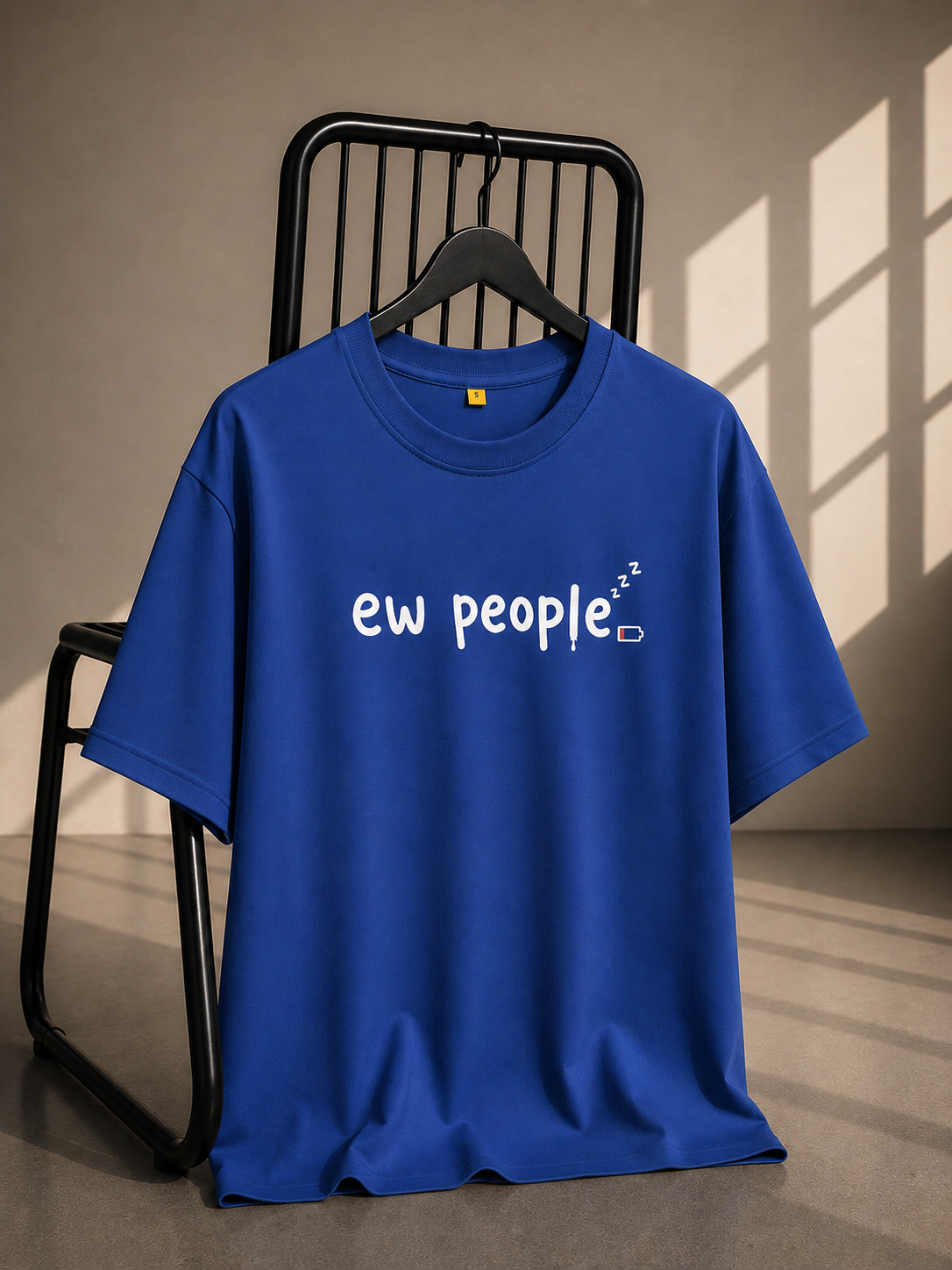 Royal blue oversized French Terry cotton T-shirt featuring an Ew People text graphic with a low battery icon on the front.
