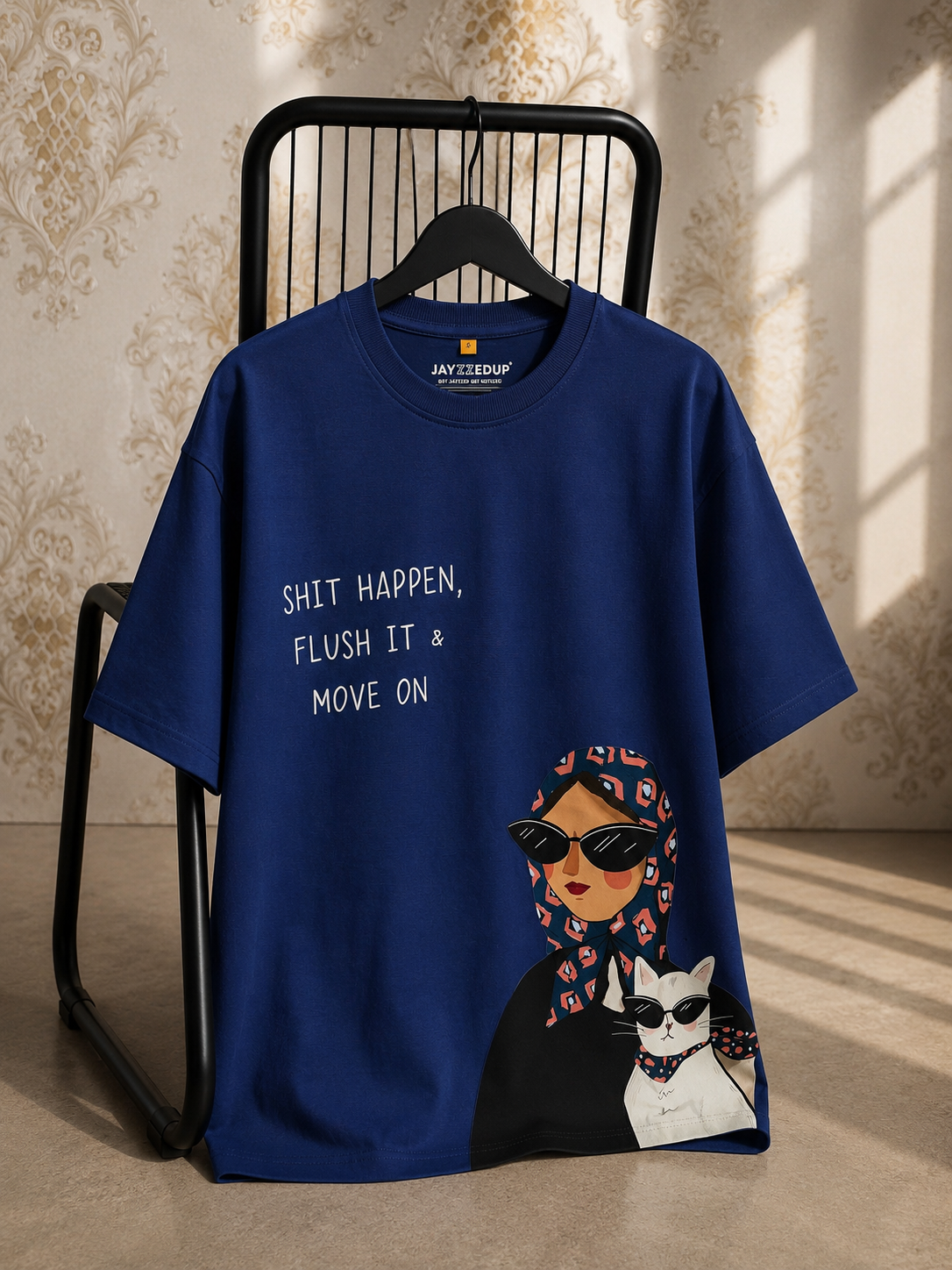 Royal blue oversized unisex graphic T-shirt featuring the quote "Flush It & Move On" with a stylish illustrated graphic, made from 220–240 GSM bio-washed French Terry cotton.