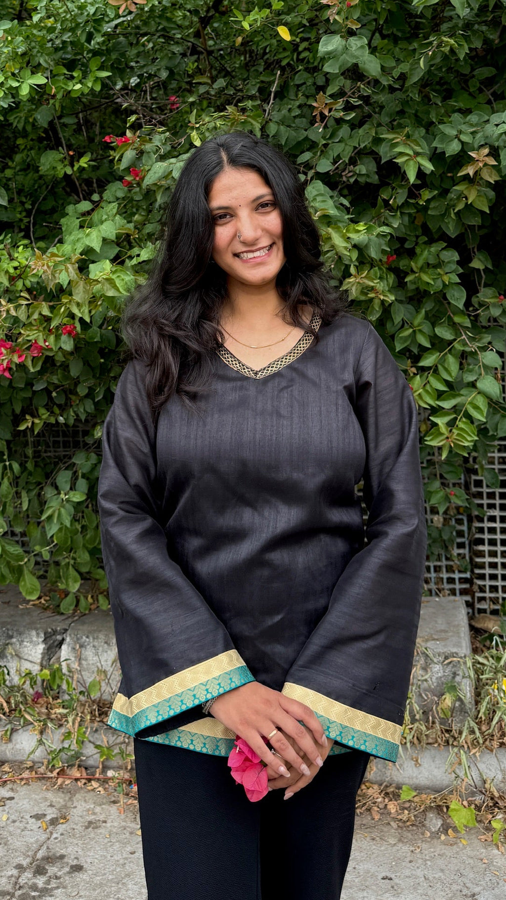 Black V-neck bell sleeve kurti with teal and gold border