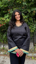 Black V-neck bell sleeve kurti with teal and gold border