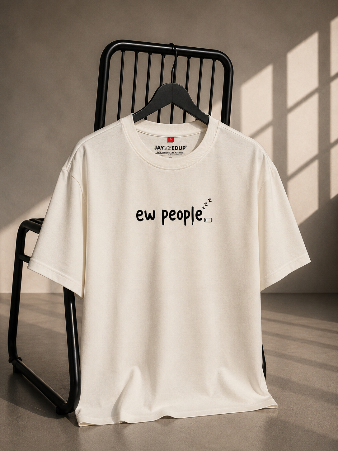 White oversized French Terry cotton T-shirt featuring an Ew People text graphic with a low battery icon on the front.