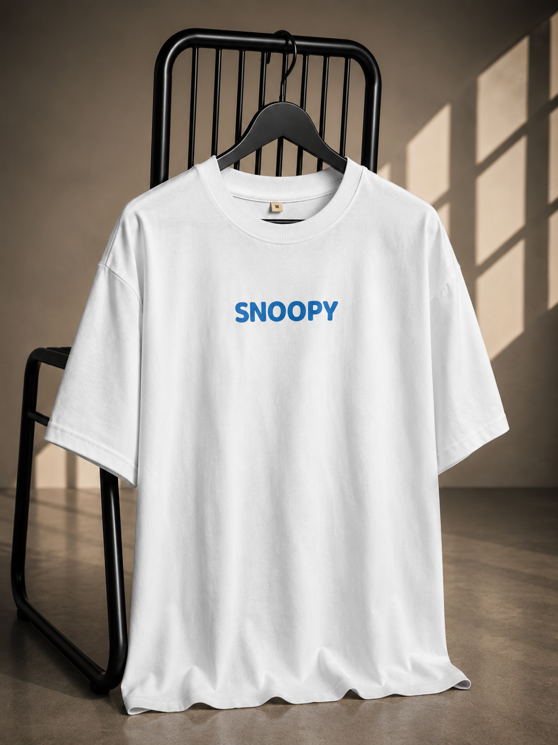 White oversized French Terry cotton T-shirt with Snoopy logo print on the front.