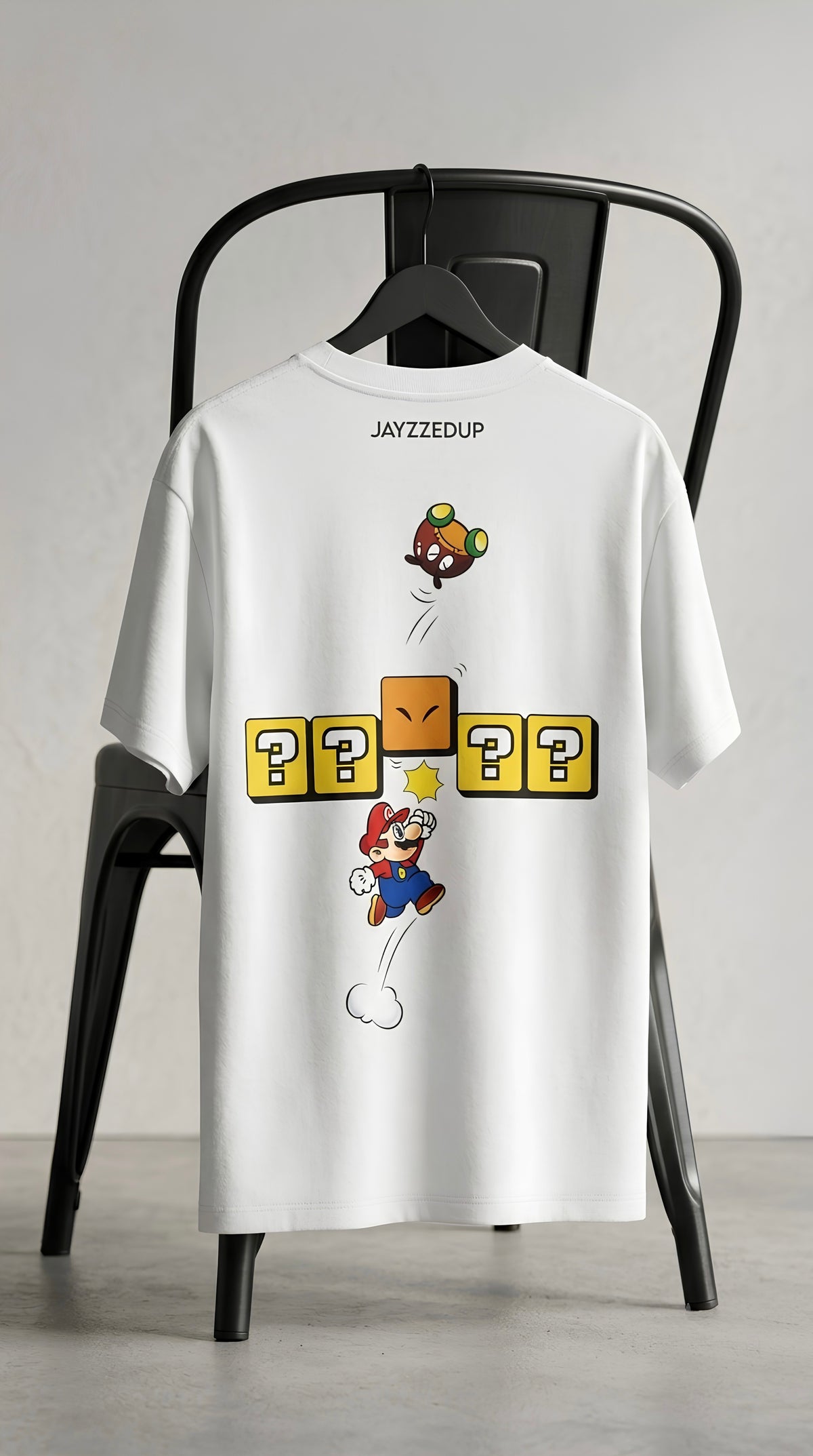 White oversized unisex gaming-inspired graphic T-shirt with playful retro game artwork on the back.
