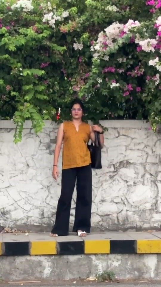 lotus print top paired with trousers